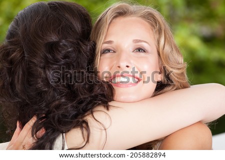 Close-up of two best friends hugging