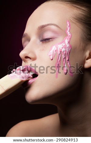 Fashionable girl eating ice-cream and melting down