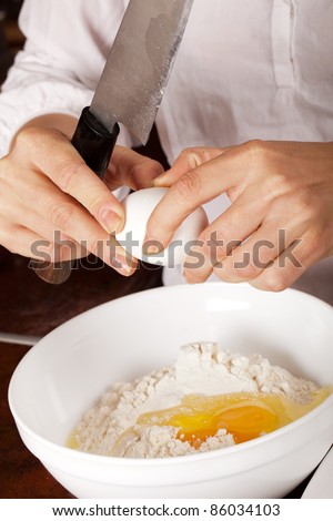 Man is about to prepare a dessert for his lovely woman: eggs are smashed... Can he finish this cake?