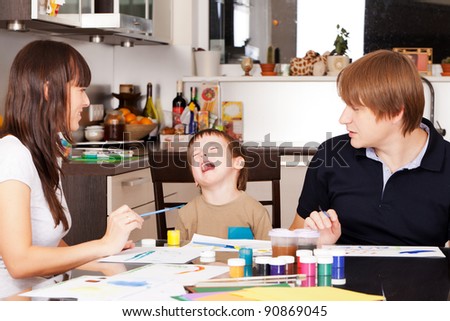 Capricious boy don\'t want to paint with parents
