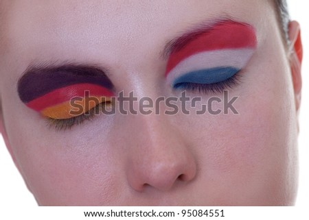 Young girl is dreaming about score in match between Germany and Netherlands: EURO 2012, group B, 13th of June. Focus on eyelashes.