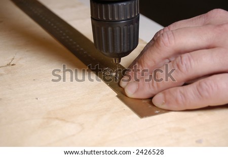 man hands working with hand drill