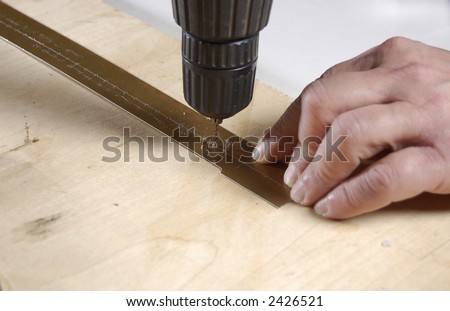 man hands working with hand drill