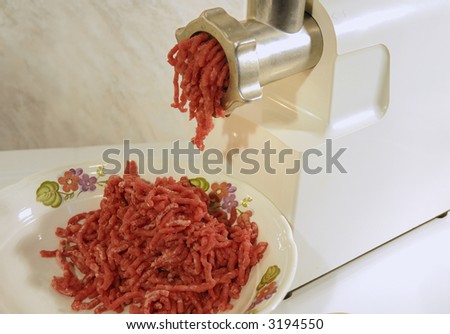 preparing mince with electrical meat grinder