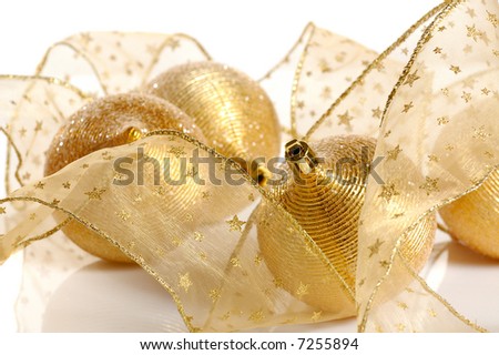 Christmas decoration-golden balls and transparent golden ribbon isolated on white