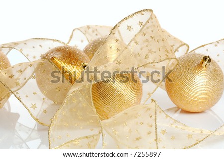 Christmas decoration-golden balls and transparent golden ribbon isolated on white