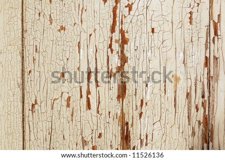 old oil paint peeling away from wood surface
