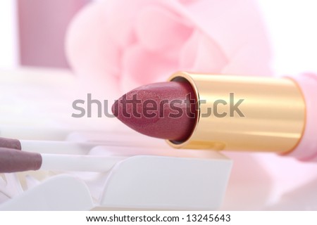 makeup set with soap roses, lipsticks, powder, sticks of eye shadows
