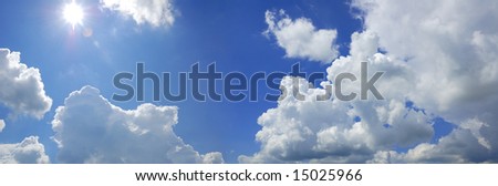 blue cloudy sky with sun panorama