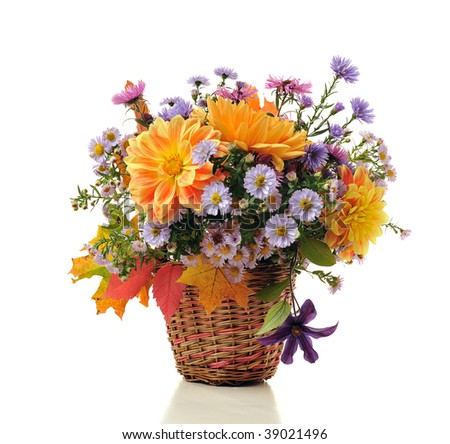bouquet of autumn flowers in basket isolated on white