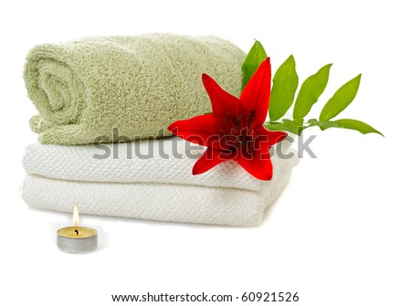 spa with red lily on white background