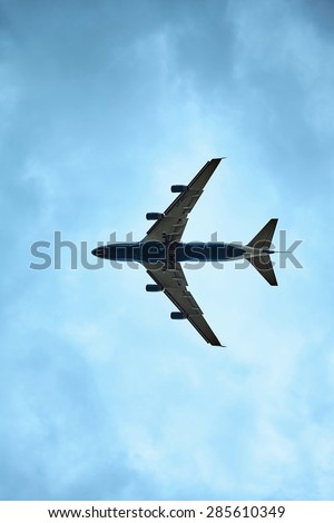 ST. PETERSBURG, RUSSIA - JUN 21, 2014: A Boeing 747 in the sky with landing gear comes in to land at the airport Pulkovo.