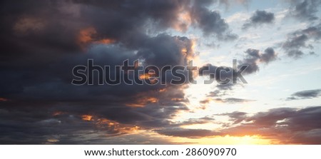 The evening sky with cumulus clouds