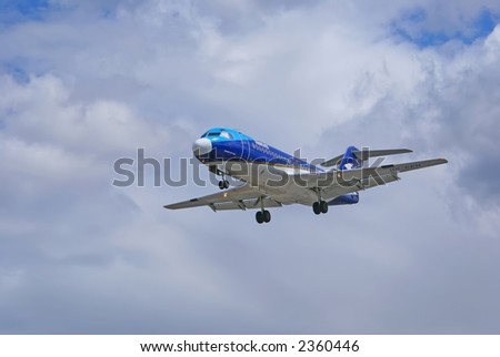 landing plane over grey sky