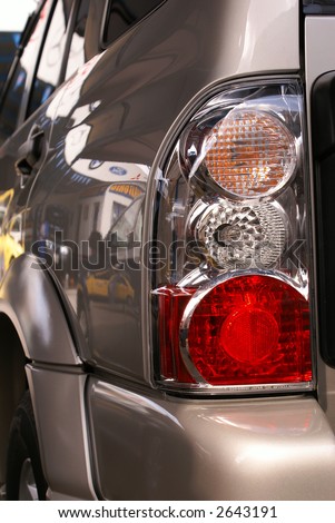 Car headlight close-up. Turn, stop and reverse signals.