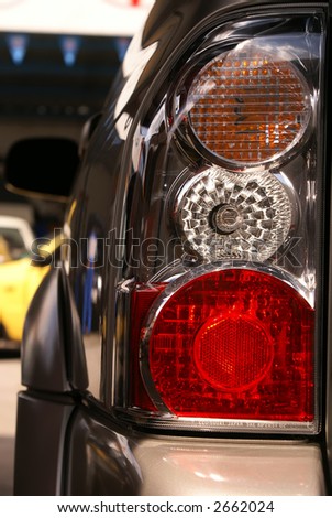 Car headlight close-up. Turn, stop and reverse signals.