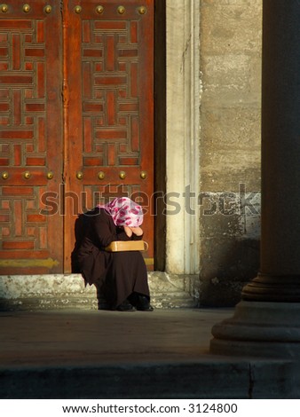 Crying woman with headscarf, in Istanbul, candid shot