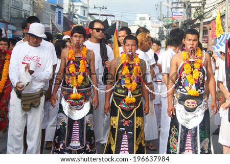 PHUKET, THAILAND - OCTOBER 13: Traditional Mah Song or warrior in the street procession of the Phuket Vegetarian Parade in Phuket Town, Phuket, Thailand on the 13th October, 2010.