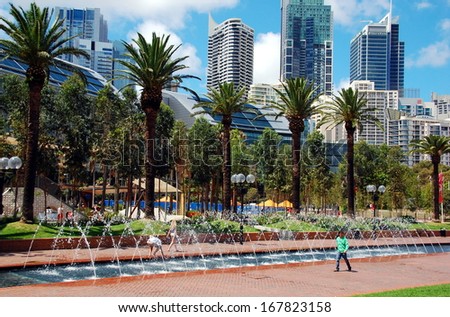 Sydney, Australia - FEBRUARY 20: Fountains and skyscrapers in Tumbalong Park in Sydney - February 20, 2013