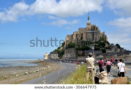 LE MONT SAINT MICHEL, FRANCE - MAY 30: View on the ancient village of Mont Saint Michel, old traditional colorful houses and its roofs. Le Mont Saint Michel, France - May 30, 2014