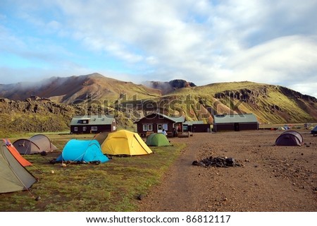 Camping in Landmannalaugar, Iceland.  This area is a popular tourist destination and hiking hub in Iceland\'s highlands.  It is known by its multicoloured mountains, lava fields and hot springs.