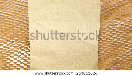 Recycled blank crumpled paper and wrapping paper with holes background