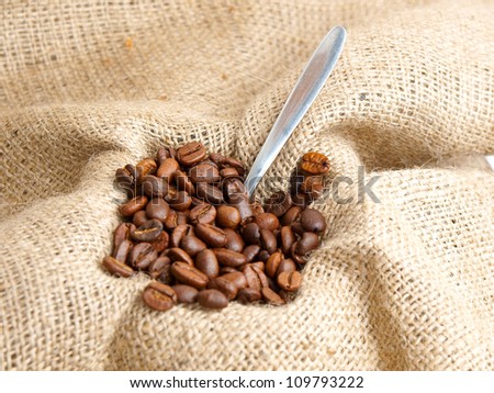 Coffee beans on brown jute background  vintage Bag