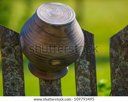 Old broken jars on the wooden fence