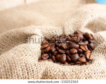 Coffee beans on brown jute background  vintage Bag