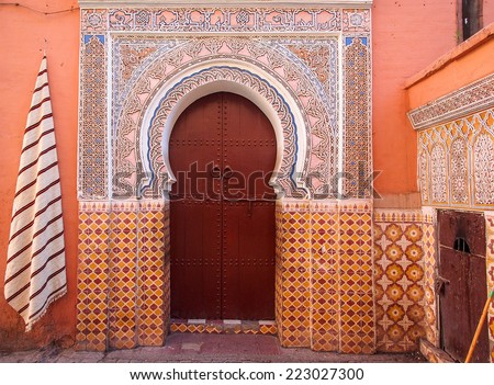 Arabic old style door to a house in an orange wall