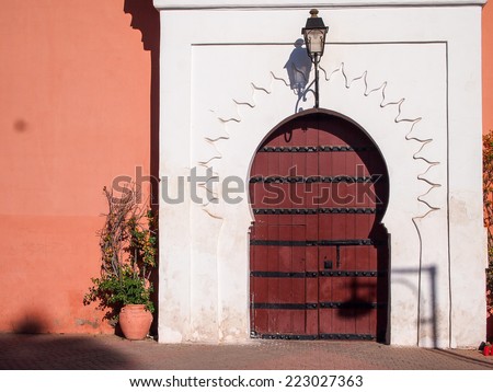 Arabic old style door to a house in an orange wall