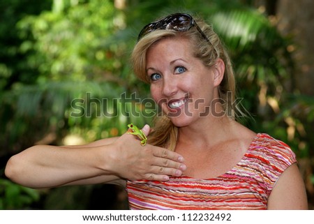 Woman in the jungle with a Tree Frog