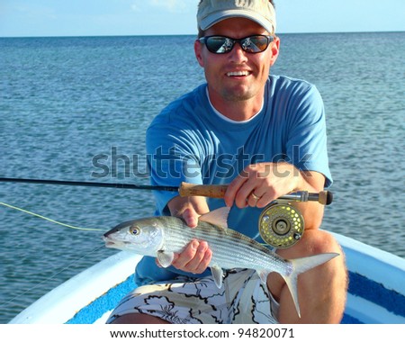 Saltwater Fly Fisherman with the elusive bonefish, fly rod and reel
