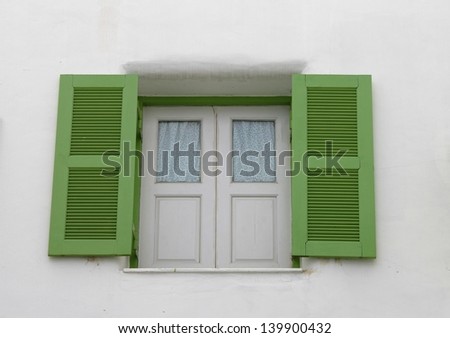 opened old window with white wall