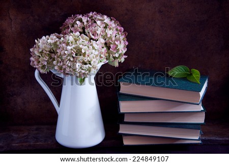 Dried hydrangea flowers and books