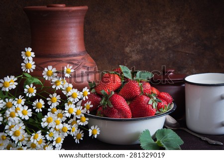 Strawberry, milk, ceramic jug and daisies in the style of Dutch still life