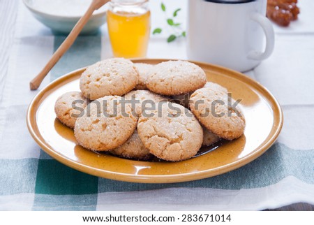 Homemade sugar honey cookies on a yellow plate