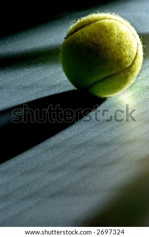 Tennis ball with racket shadows