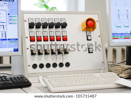 Control panel with computer monitor at wood factory