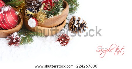 Christmas card with red balls, with cones in the snow