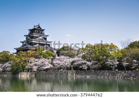 Hiroshima castle on the side of Otagawa river in spring