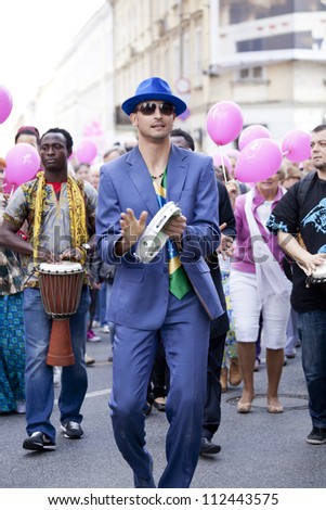 WARSAW POLAND SEPT 8 Unidentified Carnival dancers on the XV Pink Ribbon Walk against the Breast Cancer september 8 2012 in Warsaw Poland WARSAW POLAND SEPT 8 Unidentified Carnival dancers on the XV Pink Ribbon Walk against the Breast Cancer september 8 2012 in Warsaw Poland