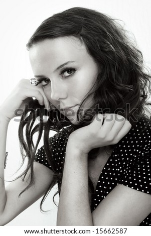 Desaturated photo of young female on white background