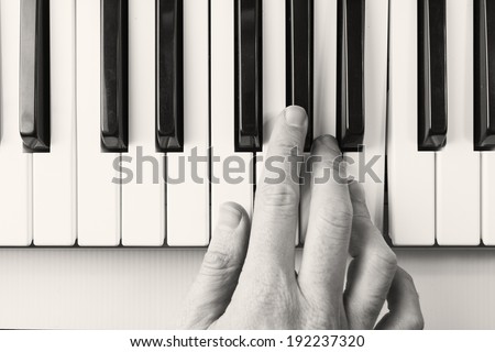 Black and white, piano player viewed from above