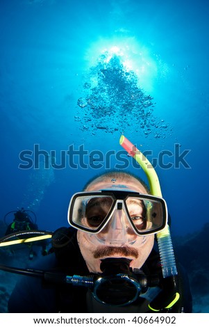 Funny diver with bubbles