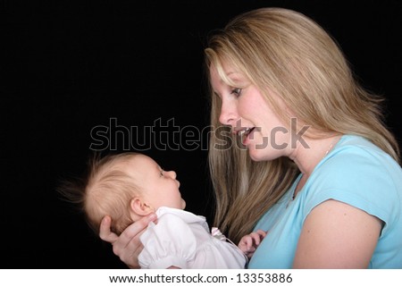 A new mother talks to her baby daughter.