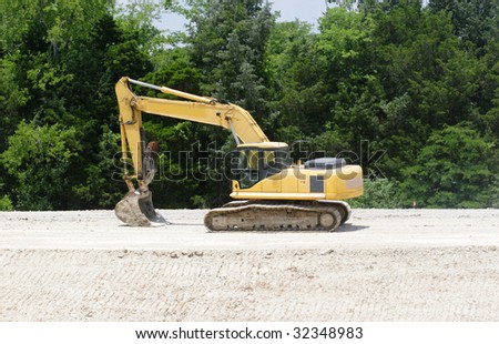 A dirt mover sits on its work.