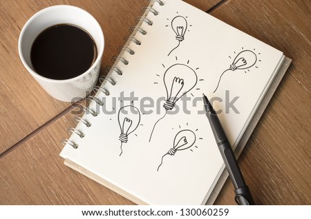 A Cup of Coffee and Light bulb Sketch Idea with Pen