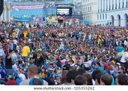 KIEV, UKRAINE - JUNE 15: Ukrainian, Swedish and English fans in the fanzone on match Euro 2012 between Ukraine - France and England - Sweden on June 15, 2012 in Kiev, Ukraine. Zone for the fans EURO