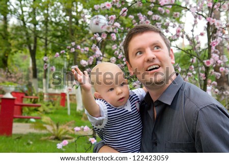 Father and his son surprised of something outdoors